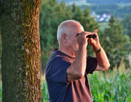 Man bird watching