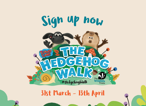 A beige background with some greenery at the bottom and a central logo feature the text The Hedgehog Walk with sheep and hedgehog cartoon characters waving. Text above the image reads 'Sign up now' and below 31st March - 13th April